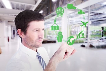 Poster - Composite image of businessman pointing with his finger
