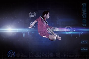 Fototapete - Composite image of football player in red kicking