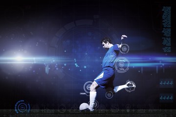 Wall Mural - Composite image of football player kicking ball