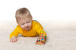 © SergiyN - Baby boy is playing with a toy