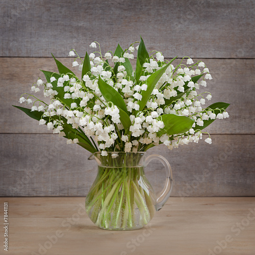 Naklejka dekoracyjna lilies of the valley on the old board