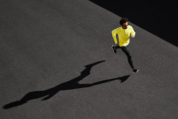 running man sprinting for success on run. top view athlete runne