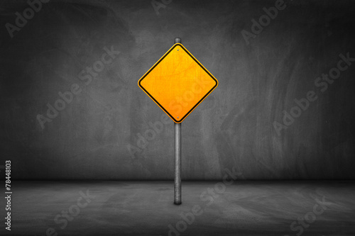 Cuadros en Lienzo Street Sign: blank yellow road sign with street wall