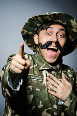 Funny soldier in military concept