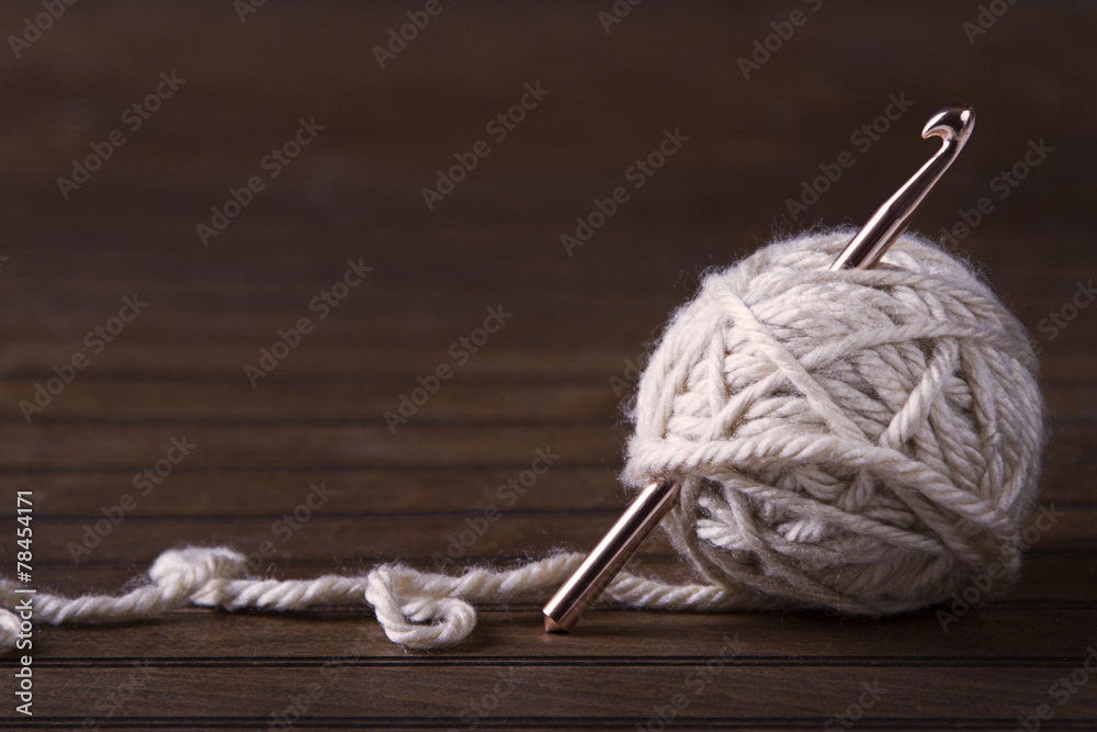 Ball of cream yarn with crochet hook Stock Photo | Adobe Stock