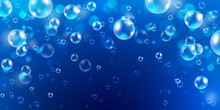Abstract Underwater Background With Sunlight And Air Bubbles