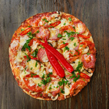 Delicious Pizza With Salami And Chili Peppers