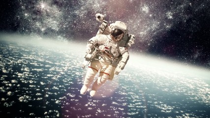 Wall Mural - astronaut in outer space against the backdrop of the planet eart