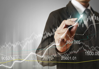 businessman hand writing business graph