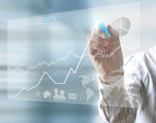 businessman hand writing business graph