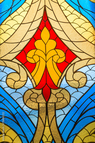 Naklejka na szybę Stained glass window with multi-colored abstract pattern.