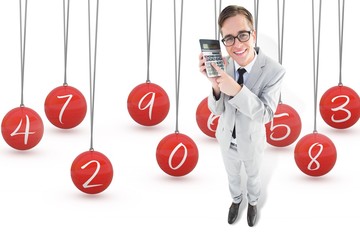 Poster - Composite image of geeky smiling businessman showing calculator