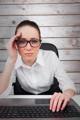 Poster - Composite image of businesswoman typing on a keyboard
