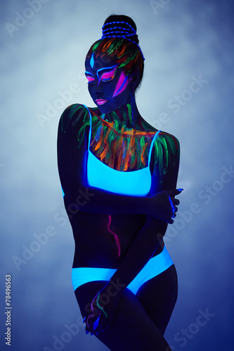 Obraz w ramie Image of fantastic girl glows in ultraviolet