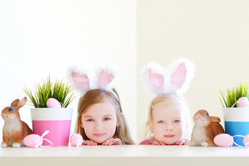 Wall Mural - Two sisters wearing bunny ears on Easter