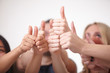 © photoniko - a group of young people, students stand together, show the thumb