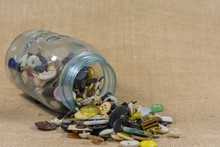 Jar Of Buttons Emptied On Its Side