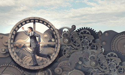 Wall Mural - Businessman in wheel