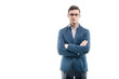 © undrey - Young strong businessman  in fashionable suit stands against the