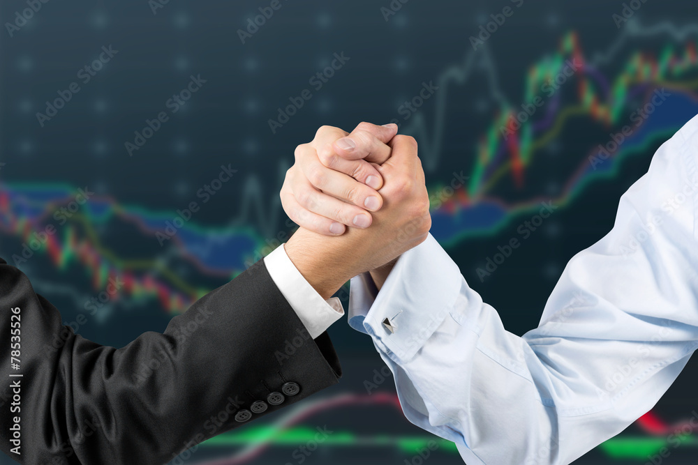 hands engaged in arm wrestling