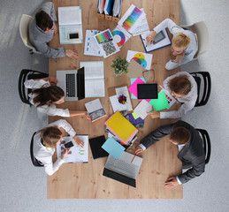 Business people sitting and discussing at business meeting