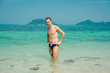 © Sergio Sergio - Handsome young man posing and stand at the tropical sea