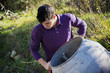 © theartofphoto - Young man working with a cement mixer