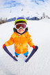 © Sergey Novikov - Smiling boy wearing mask holds ski in mountains
