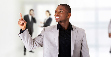 Successful businessman pointing on copy space.