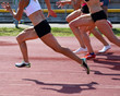 Women are running on the running track