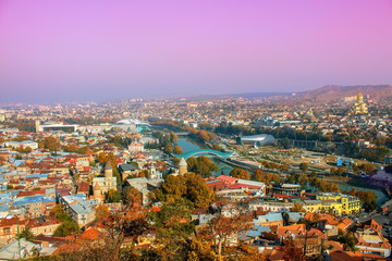 Fototapete - Beautiful panoramic view of Tbilisi at foggy sunset, Georgia 