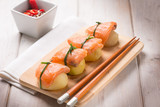 Fototapeta Maki - homemade sushi with potatoes and fresh salmon, selective focus