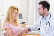 © Production Perig - Young attractive man shaking hand of his patient