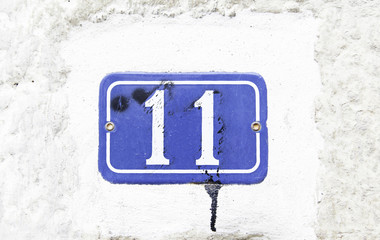 Number eleven on the wall of a house