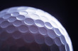 © shefkate - A close-up of a golf ball over dark background