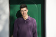 © theartofphoto - Handsome young man standing in front of house door
