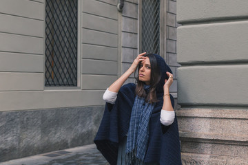 Beautiful girl posing in the city streets