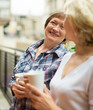 © JackF - Two mature housewives with cup of tea at terrace