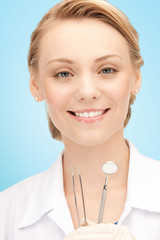 Poster - happy young female dentist with tools