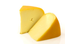 Traditional Gouda Cheese Pieces On A White Background
