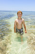 © travelview - cute boy in the warm ocean near Key West