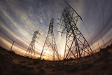 Fototapeta  - Electricity power pylons at sunset