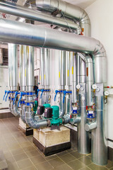 Wall Mural - technological industrial boiler unit with piping and pumps