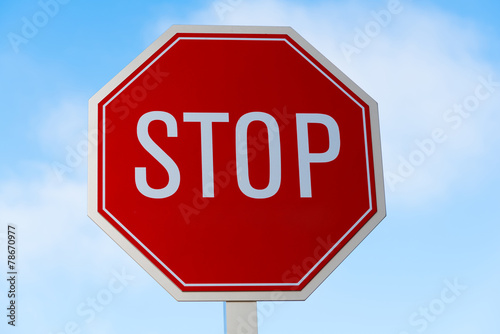 Fotografie, Obraz Stop sign in southern California with a sky blue background