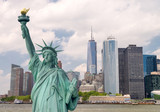 Fototapeta Miasta - New York City tourism concept. Statue of Liberty with Lower Manh