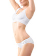 © chettythomas - Woman with perfect slim body in white underwear isolated on