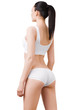 © chettythomas - Woman with perfect slim body in white underwear isolated on