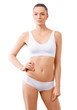 © chettythomas - Woman with beautiful slim body posing in underwear on the white