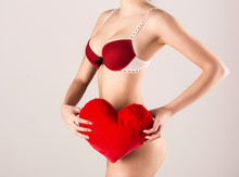 Closeup Image Of A Sexy Woman Holding Red Heart
