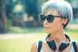 © Eugenio Marongiu - young beautiful short blue hair hipster woman with headphones mu